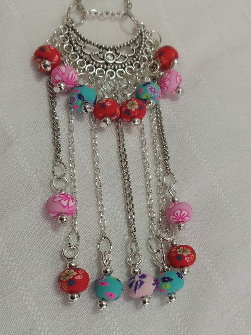 Exquisite handmade necklace featuring a half-moon-shaped Tibetan silver charm